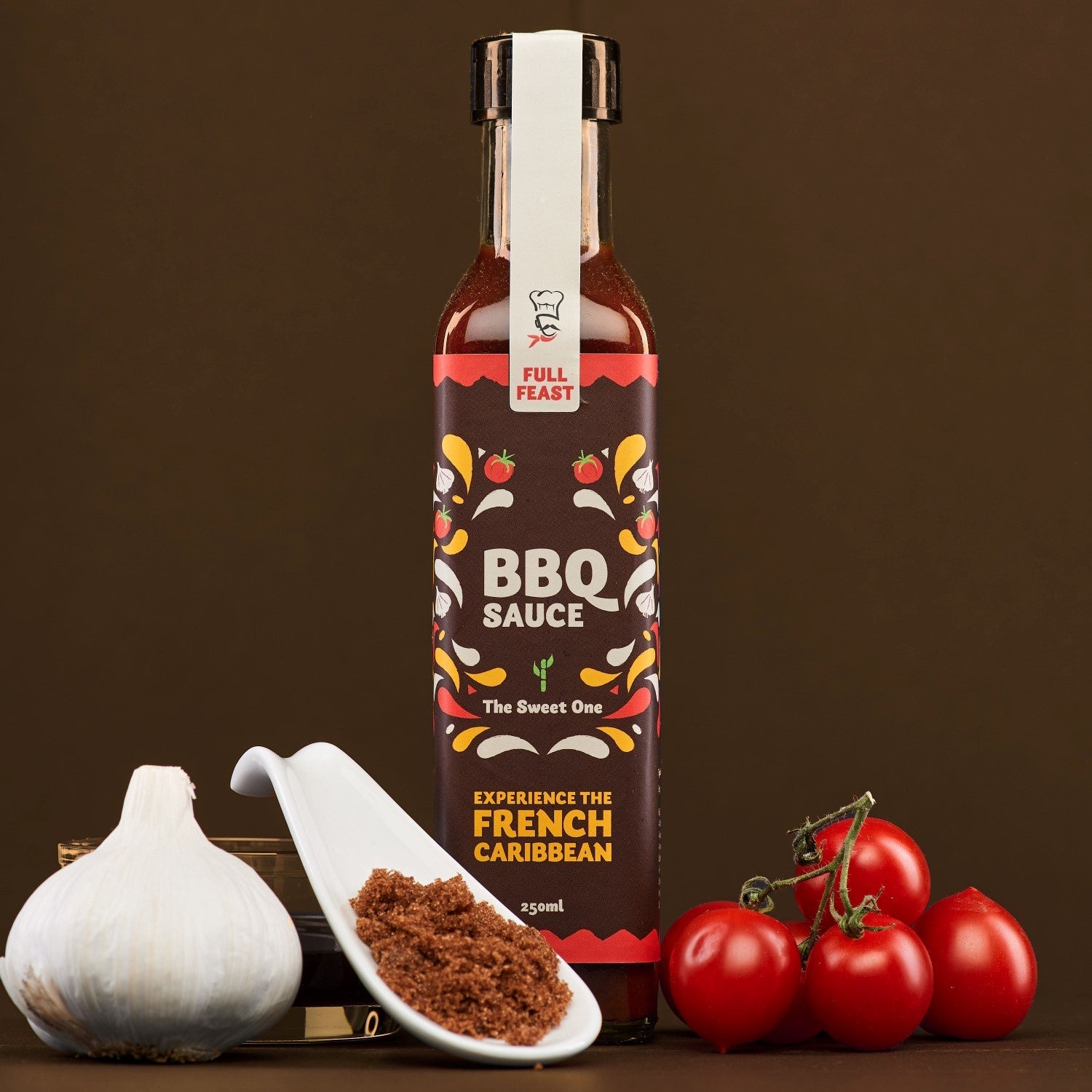 Bottle of BBQ sauce with ingredients on a brown background