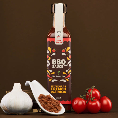 Bottle of BBQ sauce with ingredients on a brown background